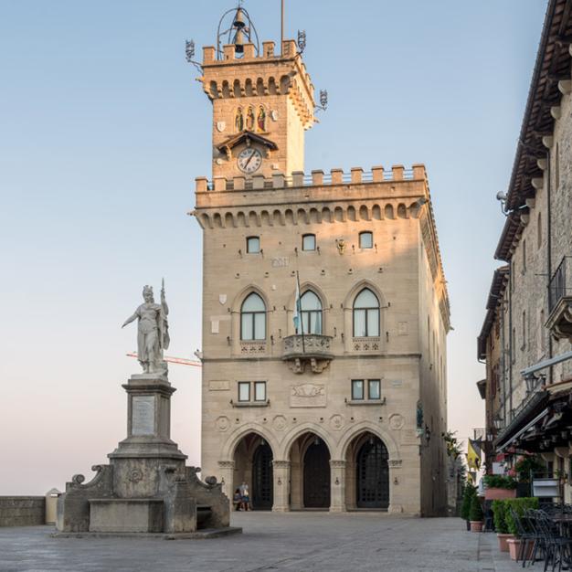 Public Palace in San Marino with statue in the square.